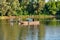 Danube island Å odroÅ¡ near Novi Sad, Serbia. Fishermans sitting in boat and holding fishing r